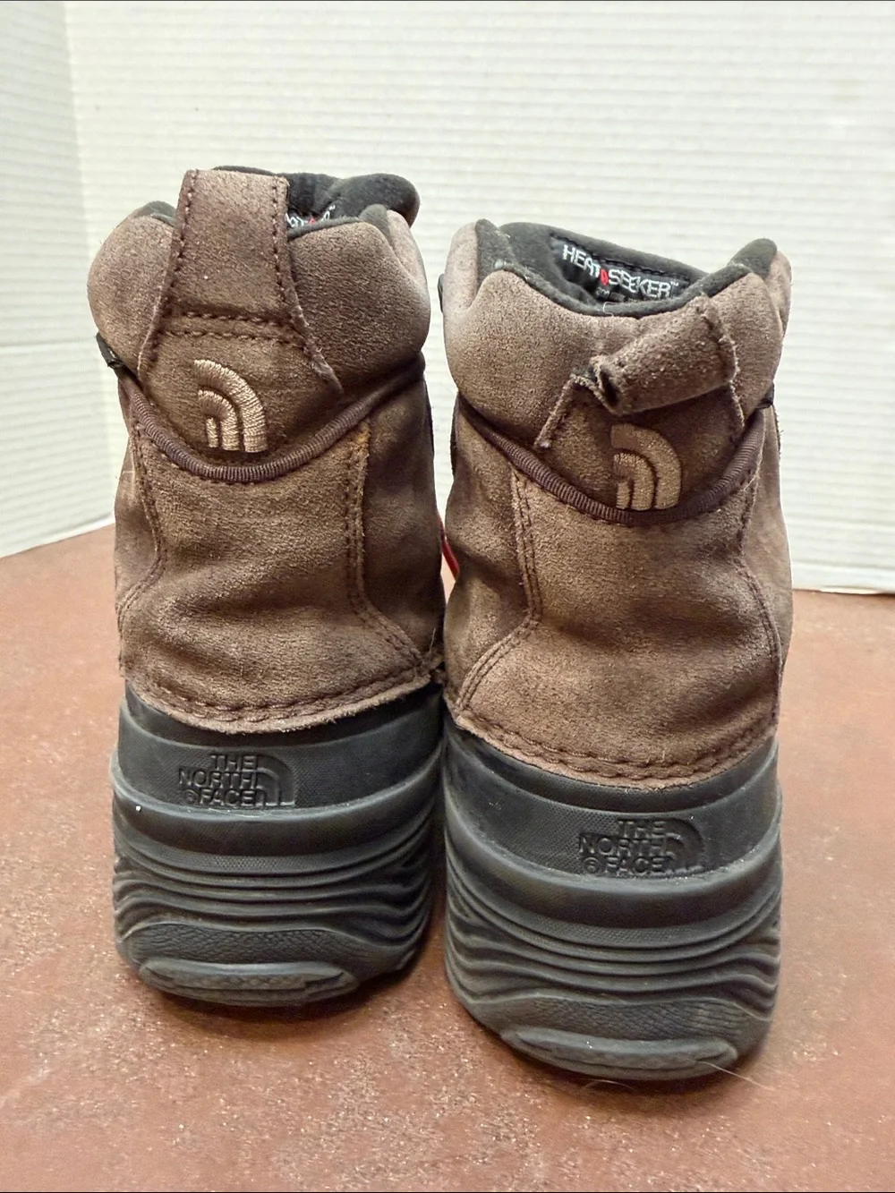 The North Face Kids Brown and Black Winter Boots with Orange Laces